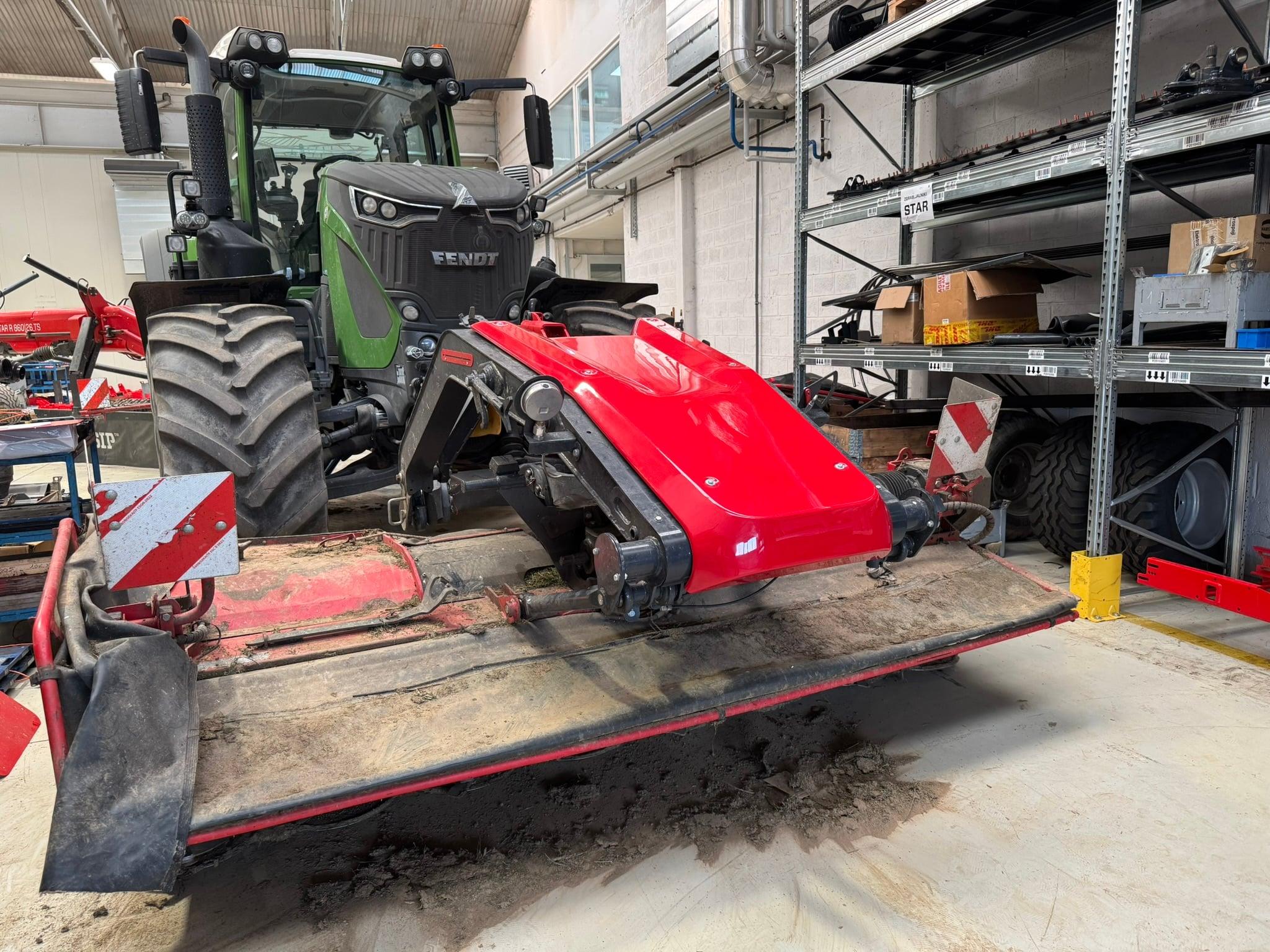 SIP front mower prototype mounted on a tractor in the factory hall