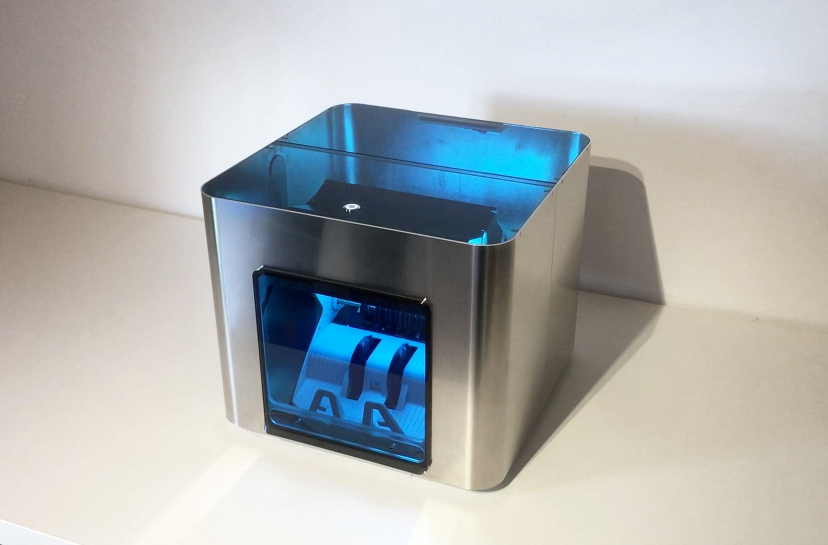 Cash Cleaner prototype with a blue-tinted lid on a white shelf