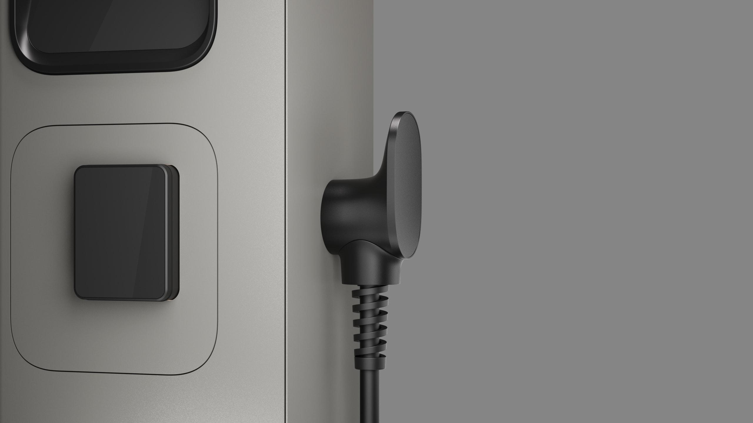 Side view of the Etrel INCH charger with the tethered cable module and plug docked in its holder