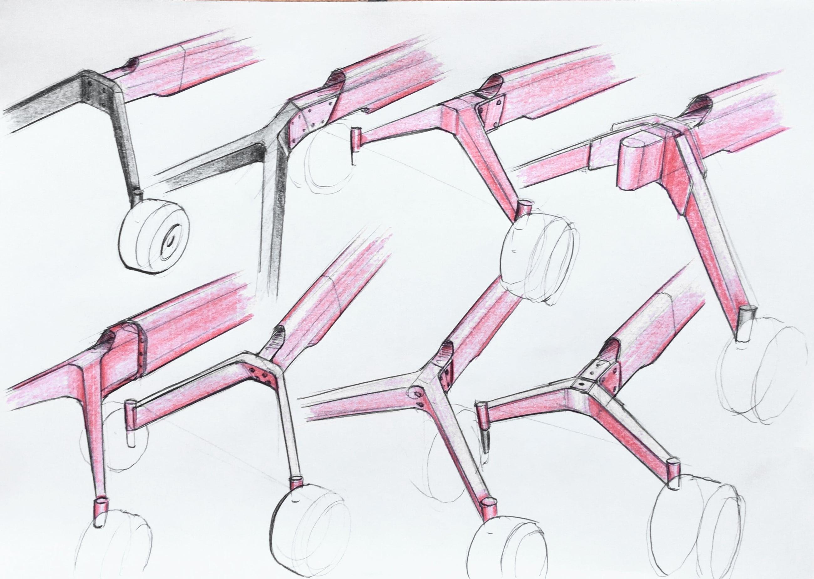 Pencil sketches of rake arm and wheel joint variations, accented in red