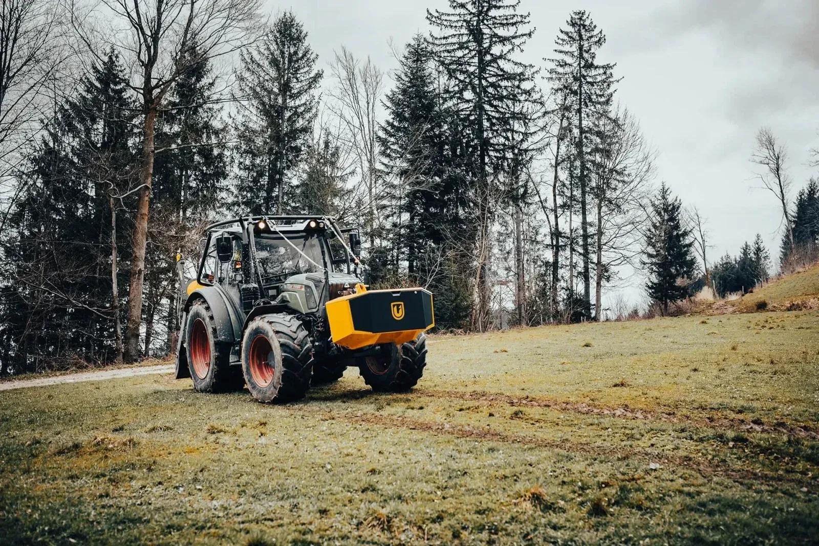 Unibox on a tractor in a forest clearing